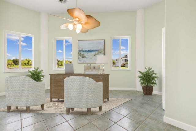 interior space with ceiling fan and light tile patterned floors