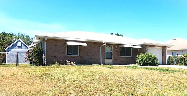 view of front of house featuring a front yard and a garage