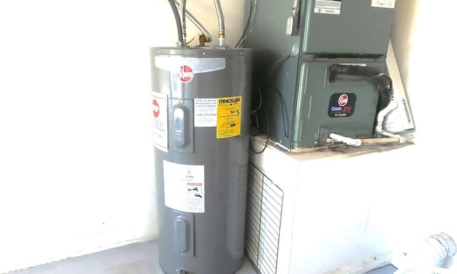 utility room featuring heating utilities and water heater