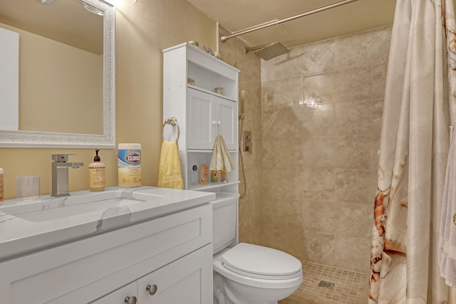 bathroom featuring a shower with curtain, toilet, and vanity