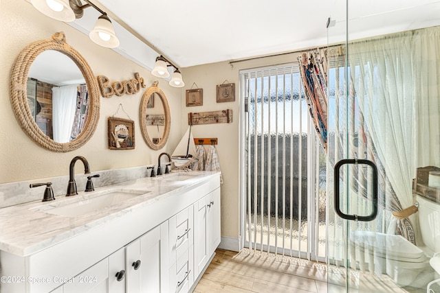 bathroom featuring vanity and wood-type flooring