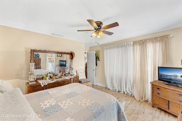 bedroom featuring ceiling fan and light hardwood / wood-style floors