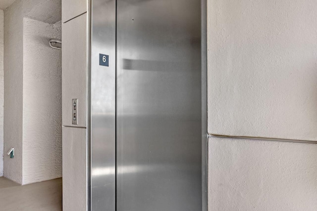 details with elevator and white fridge