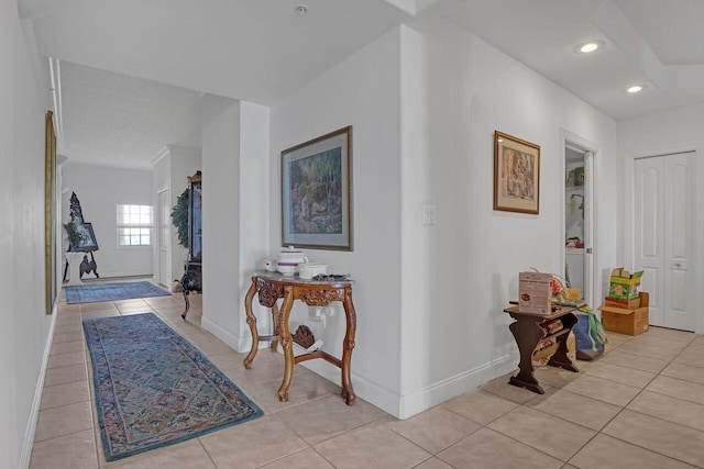 hallway featuring light tile flooring