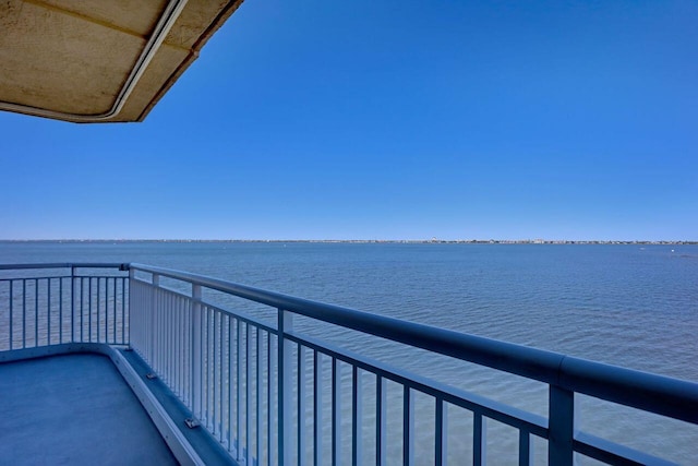 balcony featuring a water view