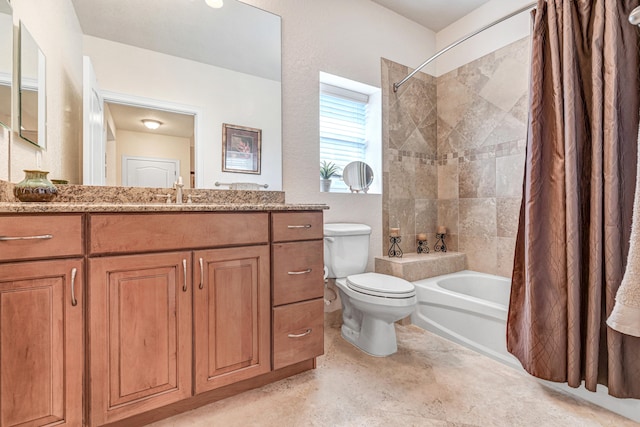 full bathroom with vanity, shower / tub combo, and toilet