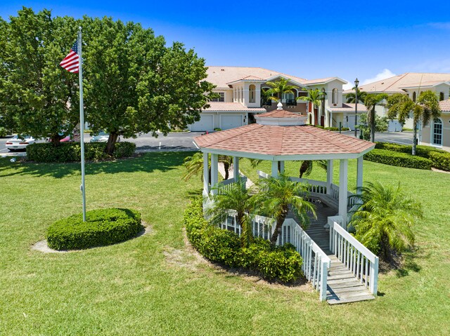 view of home's community featuring a lawn