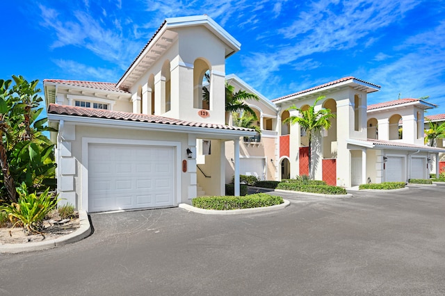 mediterranean / spanish-style house featuring a garage