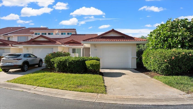 view of front of house with a front lawn and a garage