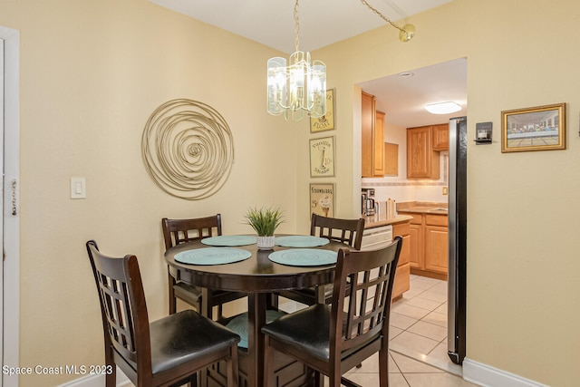 tiled dining space with an inviting chandelier