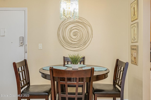 dining area with a chandelier