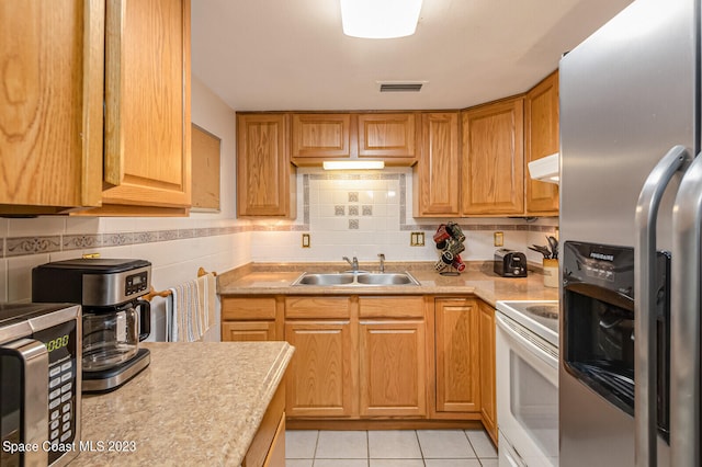 kitchen with backsplash, white electric range oven, stainless steel fridge with ice dispenser, sink, and light tile flooring