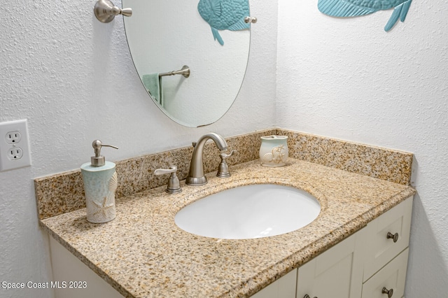 bathroom with vanity with extensive cabinet space