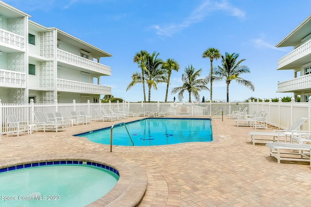 view of swimming pool featuring a patio area