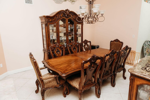 tiled dining area with a notable chandelier