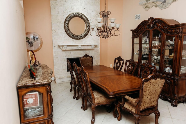 tiled dining space with an inviting chandelier