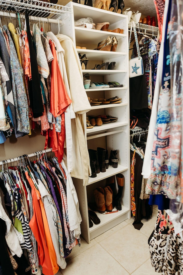 spacious closet with light tile floors