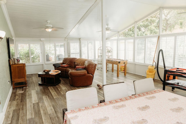 sunroom featuring vaulted ceiling and ceiling fan