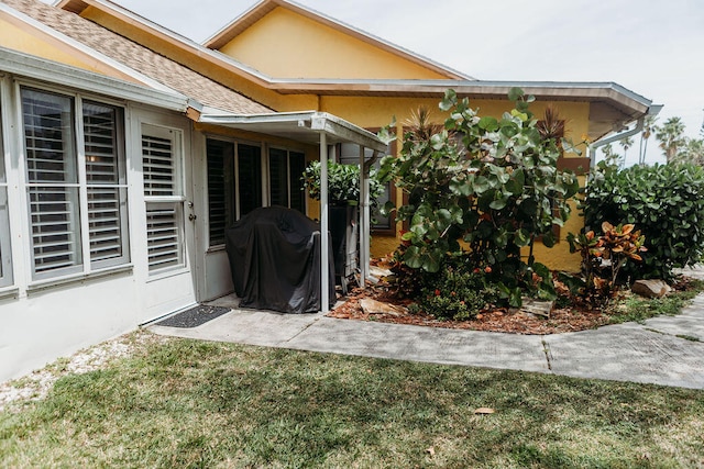 exterior space with a grill