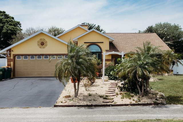 single story home with a garage