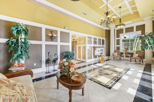 sunroom featuring ornate columns and a notable chandelier