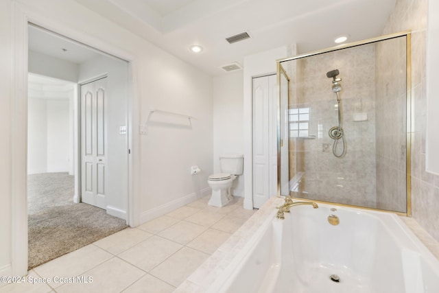 bathroom with tile patterned flooring, toilet, and plus walk in shower