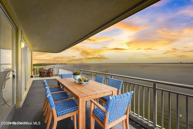 balcony at dusk with a water view