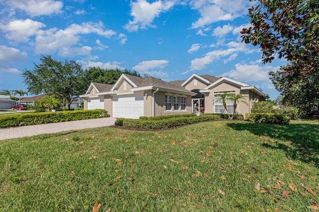 view of front of home with a garage and a front yard