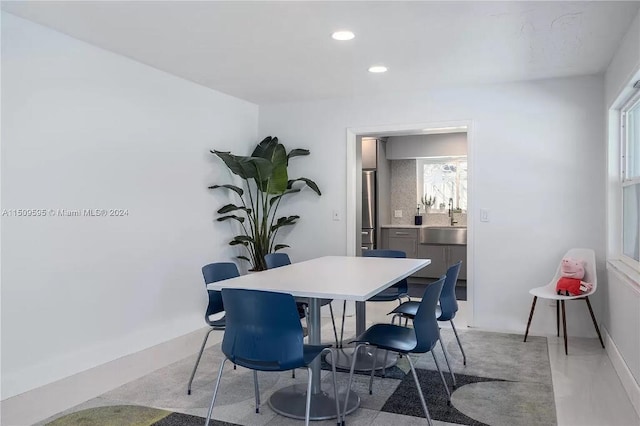 dining room with a healthy amount of sunlight and sink