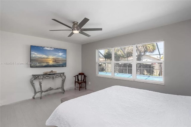 bedroom with wood-type flooring and ceiling fan