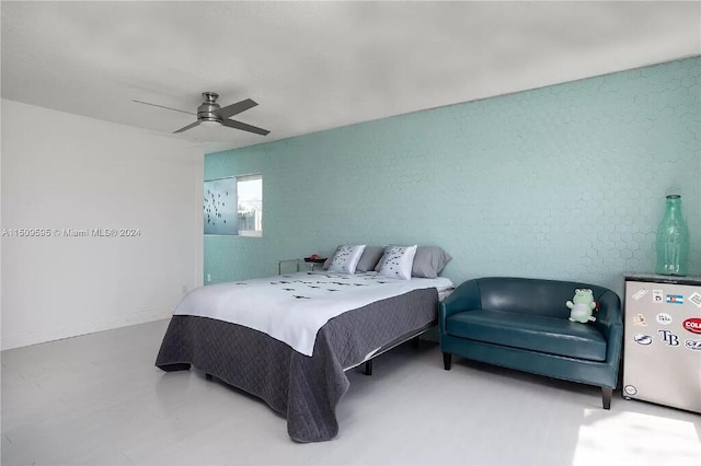 bedroom with ceiling fan and fridge