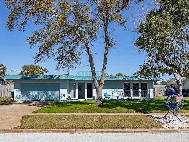 single story home with a front lawn and a garage