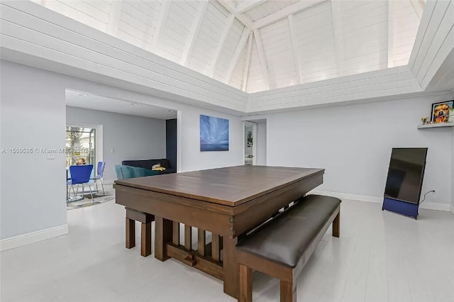 dining space featuring beam ceiling and wooden ceiling