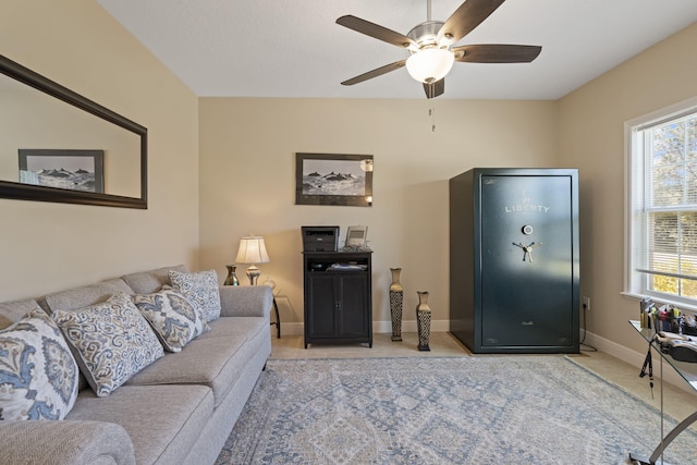 living room featuring plenty of natural light and ceiling fan