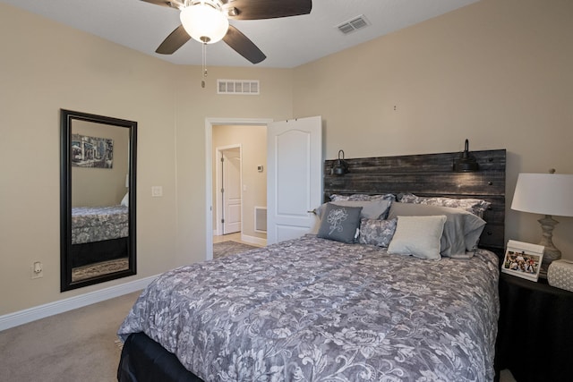 bedroom with ceiling fan and light carpet