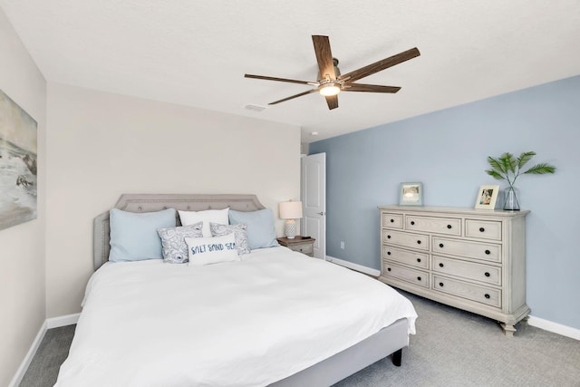 bedroom featuring light colored carpet and ceiling fan