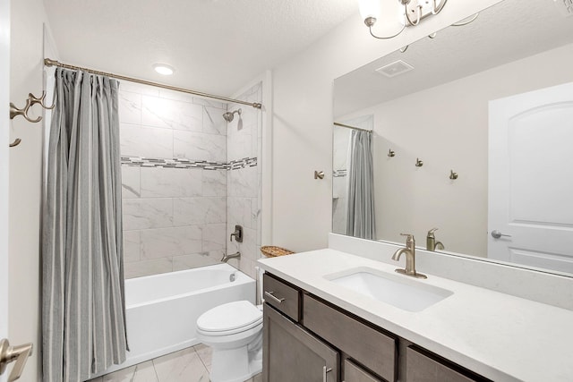 full bathroom featuring shower / bath combo, toilet, a textured ceiling, vanity, and tile floors