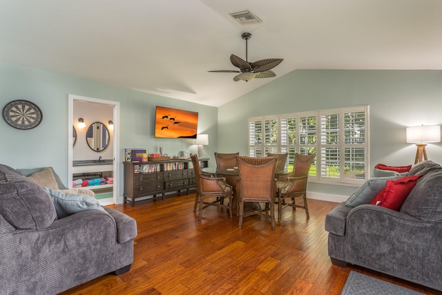 living room with ceiling fan, hardwood / wood-style floors, and lofted ceiling