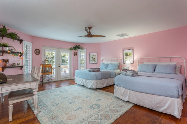 bedroom featuring ceiling fan, dark wood-type flooring, and access to outside