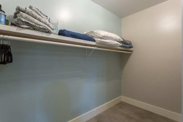 spacious closet featuring tile flooring