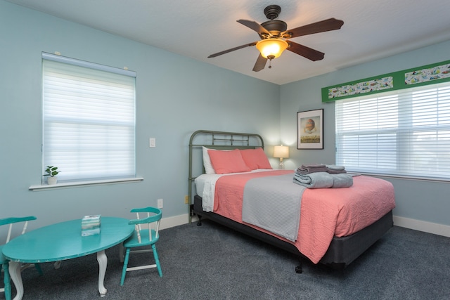 bedroom with dark carpet and ceiling fan