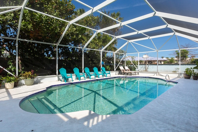 view of pool featuring a patio and a lanai