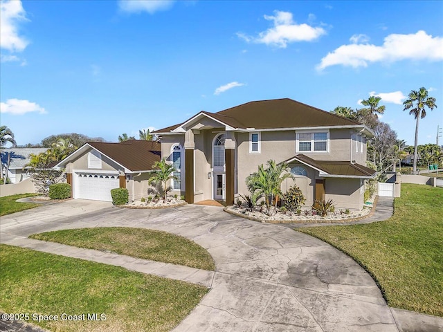 view of front of house with concrete driveway, a front lawn, an attached garage, and stucco siding