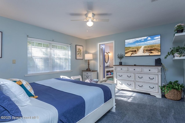 carpeted bedroom with ceiling fan and connected bathroom