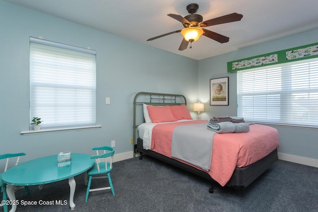 bedroom featuring ceiling fan, dark colored carpet, and baseboards