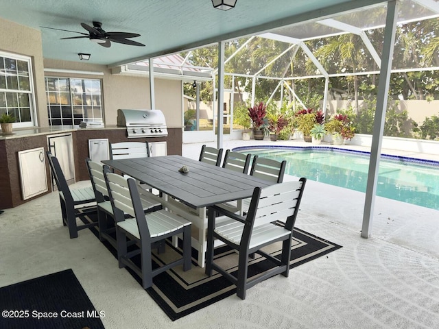 view of pool featuring a lanai, a patio area, a fenced in pool, and area for grilling