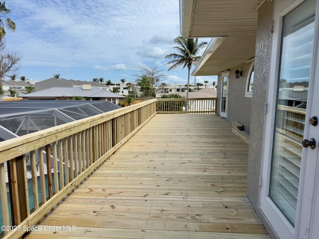 deck with a residential view and a lanai