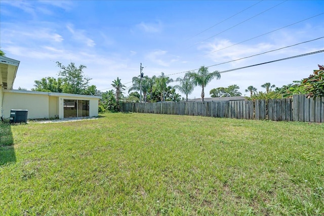 view of yard featuring central air condition unit