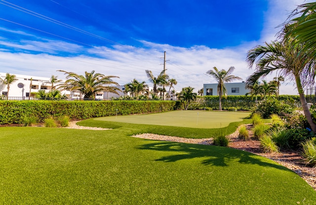 view of property's community with a lawn