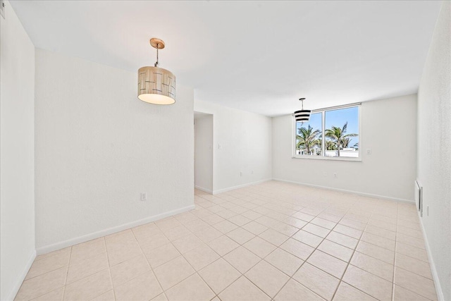 unfurnished room featuring light tile floors